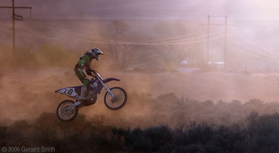 Dirt bike rider in the sage brush dunes in Taos