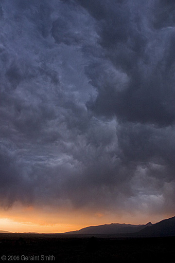 Storm cloud over Taos valley looking north to Colorado