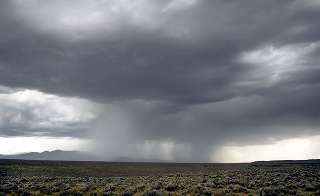 This image is of a column of rain which settled in over Pilar NM and washed out a smal bridge some culverts and a road.