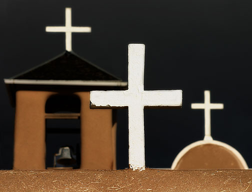 Three crosses of San Francisco de Asis church in Ranchos de Taos, New Mexico in the high desert southwest