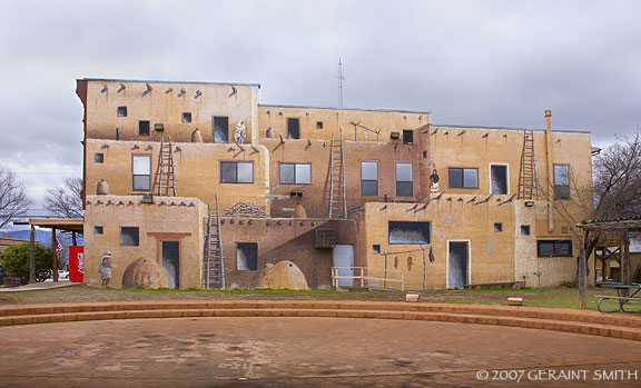 Painted Pueblo, complete with coke machine, aluminum clad windows and radio tower in Cortez, Colorado 