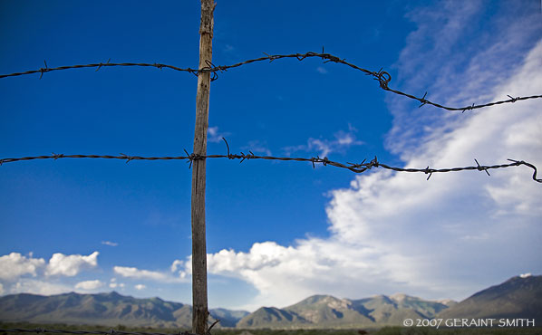 Taos Pueblo range land. One from the "wired west" series, 