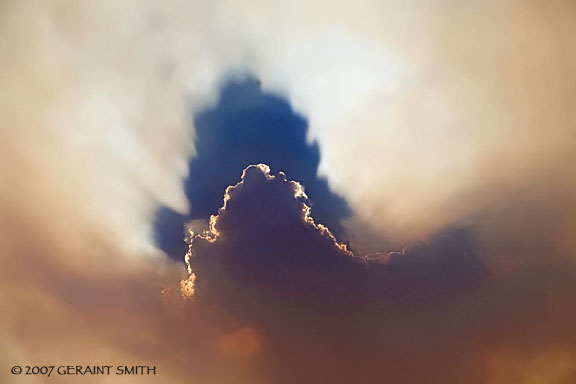 Fire Sky, The clouds and fire smoke enhanced by the sun as a fire, burned west of Taos and the Rio Grande Gorge yesterday in New Mexico