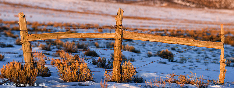 Mesa fence along Highway 64 west of Taos NM