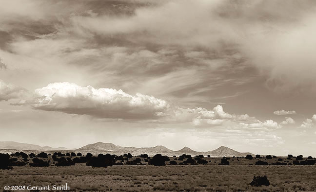 The land and sky south of Santa Fe, New Mexico