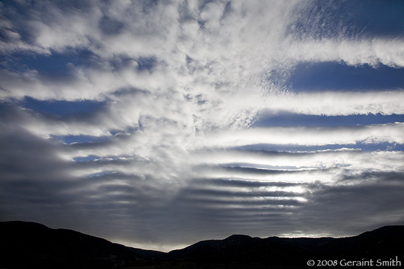 Morning sky over Taos foothills