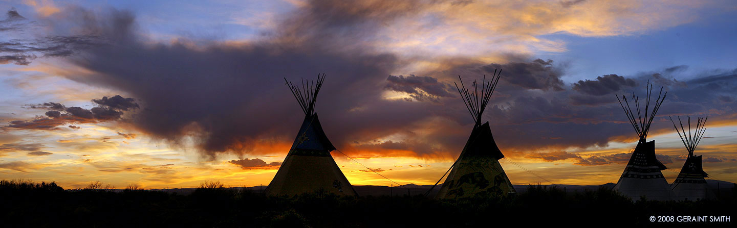 Taos Tipis with a mesa sunset sky