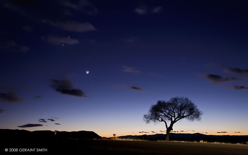 Venus and Jupiter conjuction, a waxing crescent moon and a few other celestial objects in the sky over Taos, NM
