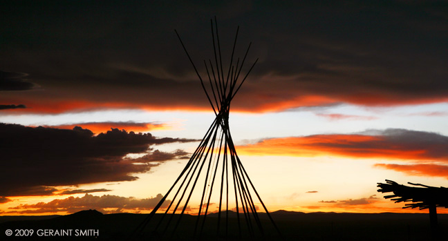 Tipi poles and a Taos sunset