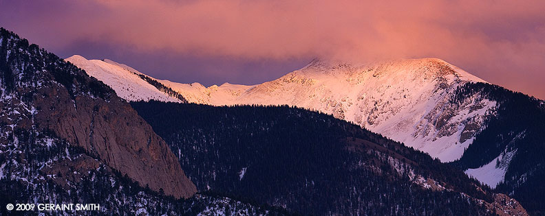 The mountains around Taos the night before the storm