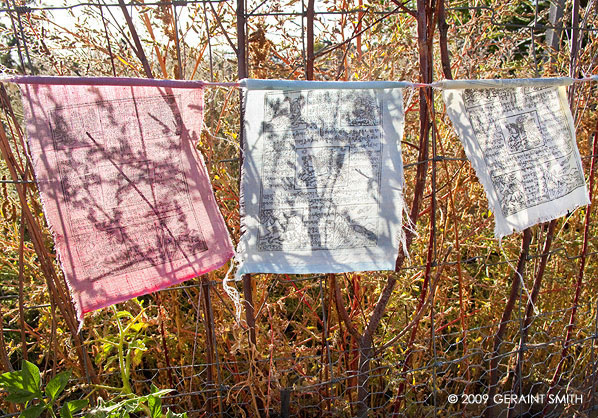 Prayer flags on the garden fence