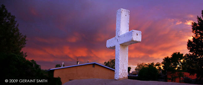 The cross and sunset at the San Francisco de Asis church Ranchos de Taos 