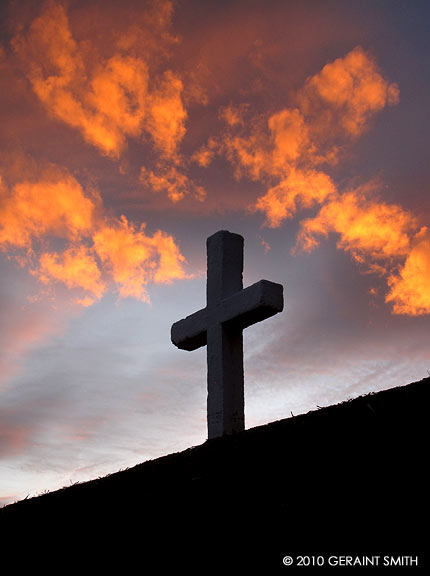 Fiery sky and cross