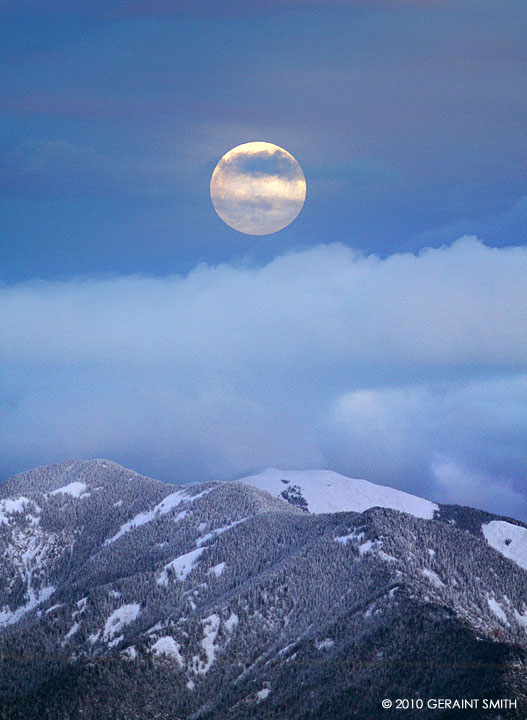 Solstice moon over Taos Mountain
