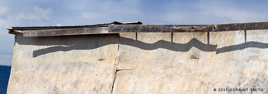 Roof serpent ... dilapidation along the high road to Taos