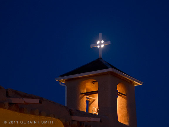 Harvest, celtic moon over the St. Francis church Ranchos de Taos, NM