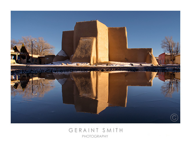 More reflections in the snow melt at the St. Francis Church, Ranchos de Taos, NM