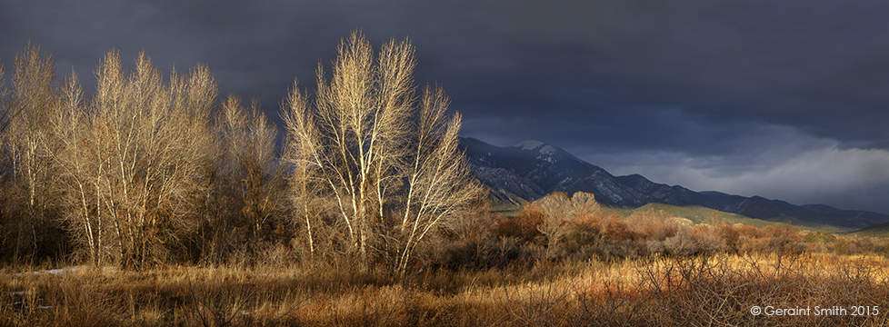 Taos Mountain breaking through the clouds