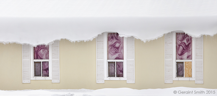 Deckle edge roof curl, during the last snowfall, Taos NM