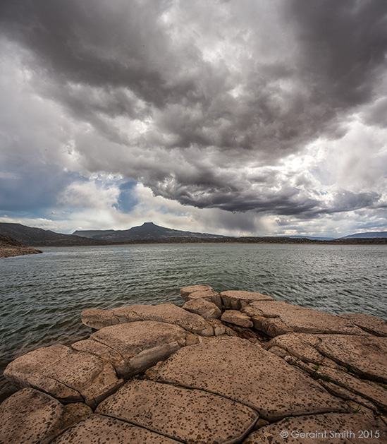 Storm brewing and rain falling over Abiquiu Lake