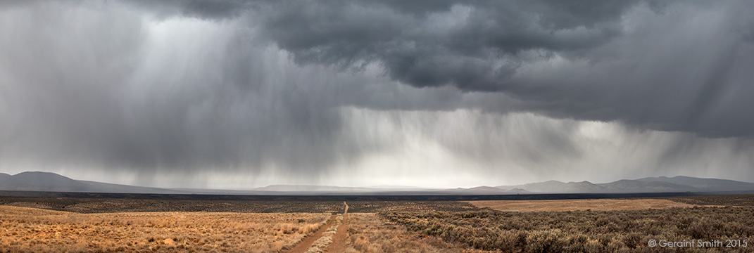 Road across the mesa and into the storm taos volcanic plateau new mexico