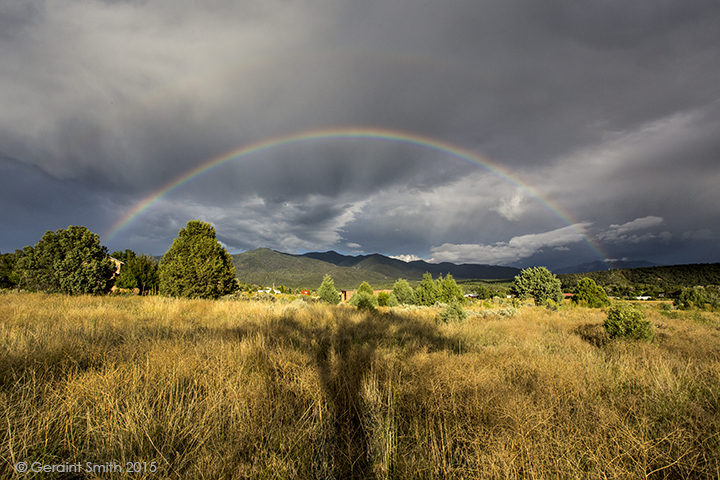 Rainbow over our meadow and shadow of the cottonwood tree in San Cristobal, NM Today is the 10 year anniversary of my website's photo of the day taos new mexico.