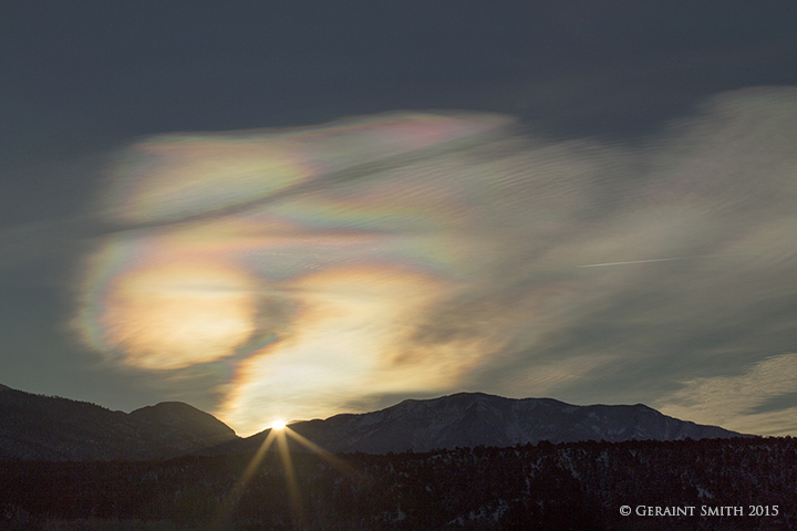 Sunrise sun dogs over Taos Mountain, from San Cristobal, NM