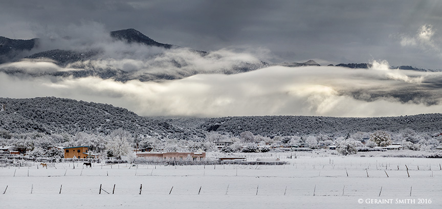 Morning clouds, snow, horses, adobe mountains Arroyo Hondo, NM