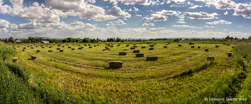 The high desert ... Arroyo Seco, NM new mexico hay bales clouds 