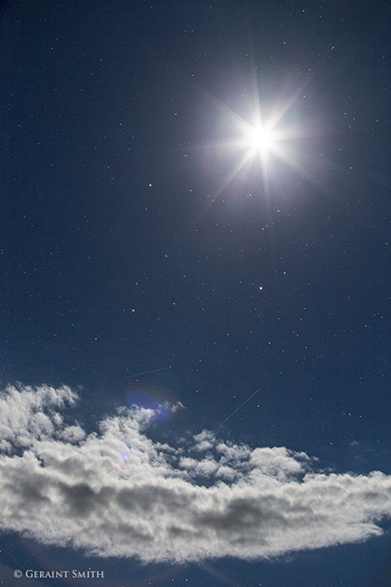 The bright, very bright moon, Saturn, Mars and Antares and a couple of meteors just above the clouds.