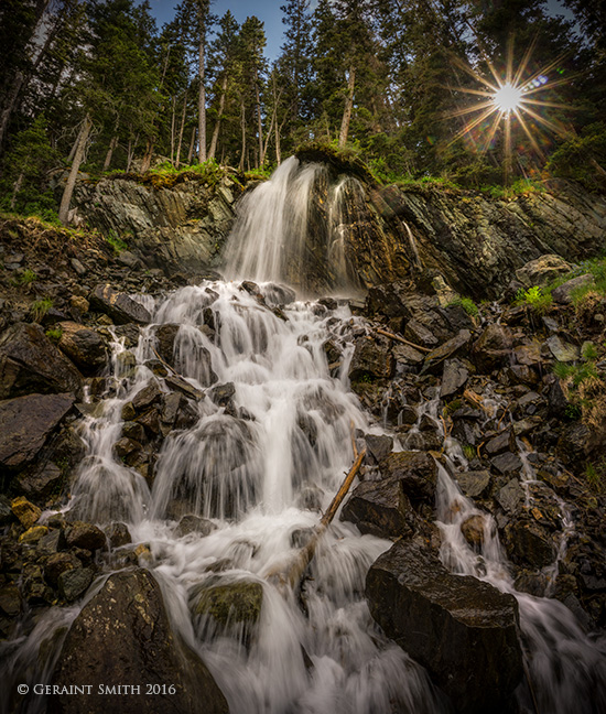 Sun setting over a Taos Ski Valley waterfal