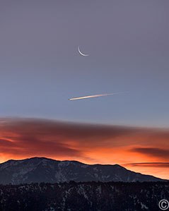 2013 December 31  This morning's sunrise, moonrise and travelers over  Taos Mountain as seen from San Cristobal