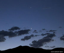 2012 July 02, Venus and Jupiter ... with Aldebaran (in the head of Taurus) just under the lower cloud, over San Cristobal, NM