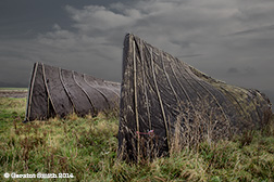 2014 November 12  Overturned fishing boats used now as storage sheds  on the Holy Island of Lindisfarne