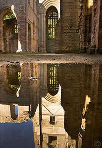 2013 October 15  Reflections in a rain puddle in Fountains Abbey, Yorkshire