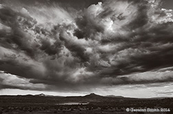 2014 September 17  A little storm over Abiquiu Lake and Cerro Pedernal, NM